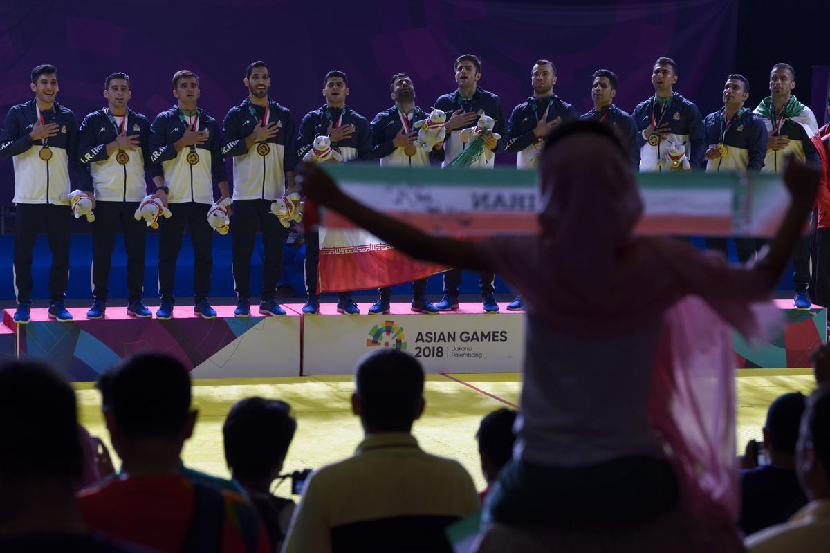 Gold medallists Iran celebrate during the victory ceremony of the men's team kabaddi event at the 2018 Asian Games in Jakarta on August 24, 2018. (Photo by CHAIDEER MAHYUDDIN / AFP)        (Photo credit should read CHAIDEER MAHYUDDIN/AFP via Getty Images)