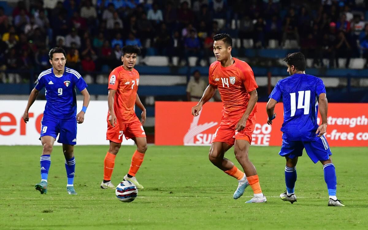 India’s Jeakson Singh (14-orange) in action against Kuwait in the SAFF Championship final at the Kanteerava Stadium. 