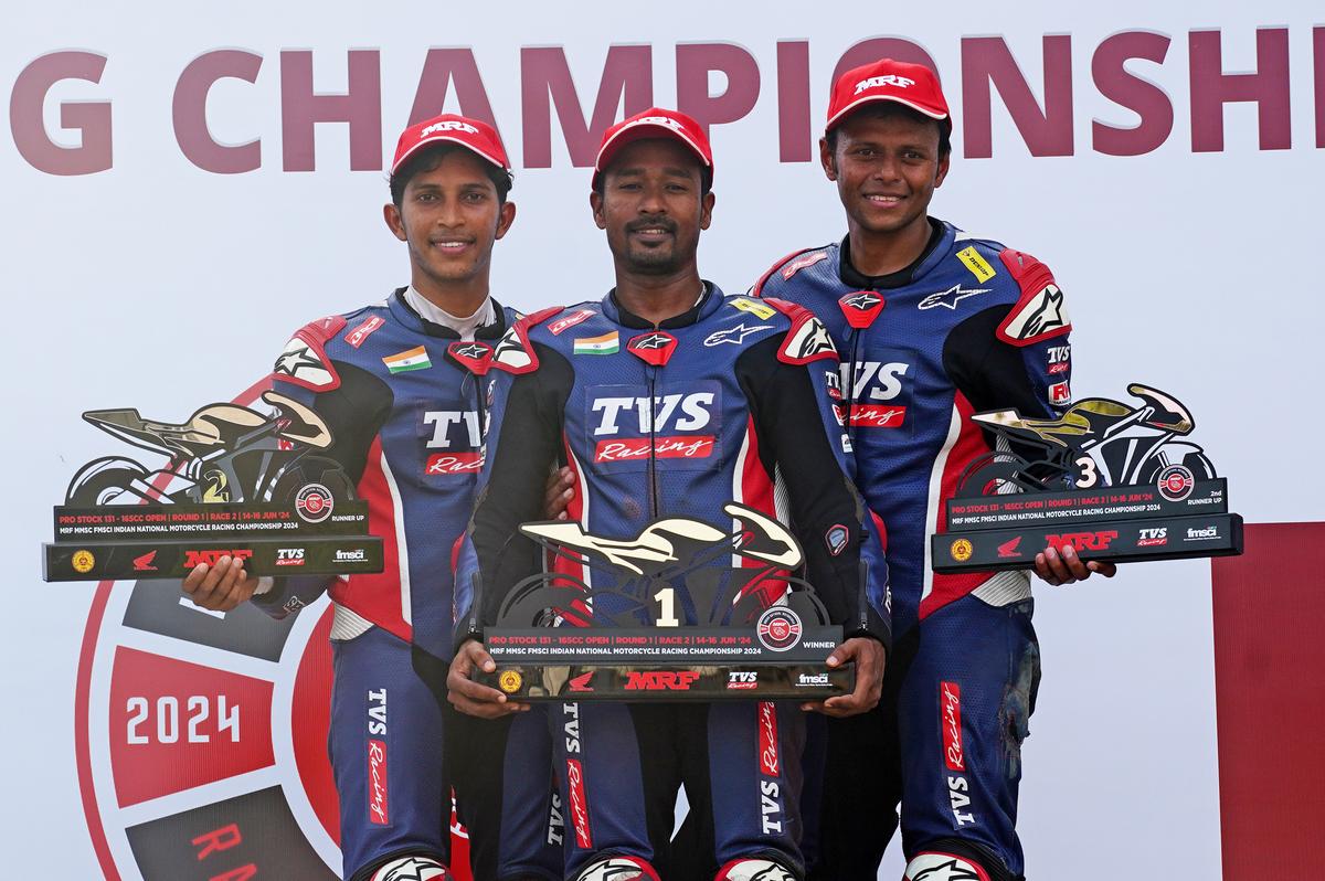 Jagan Kumar, winner of the Pro-Stock 165cc Open race, flanked by K.Y. Ahamed, left, and Deepak Ravikumar