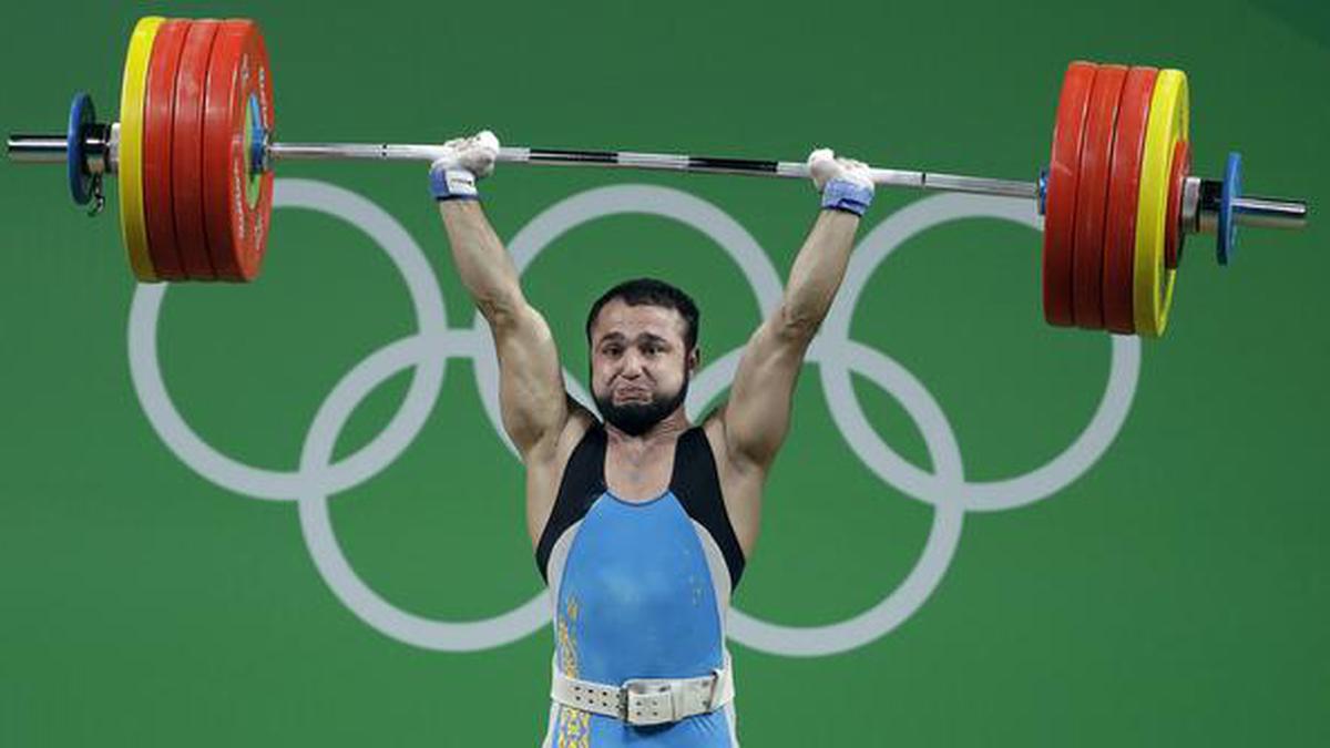 Olympic champion charged in weightlifting doping case