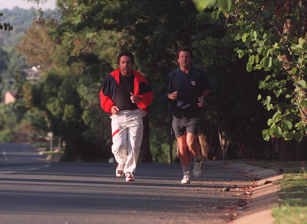 Journalist Mark Nicholas (right) goes for an early morning run with Dr Ali Bacher.