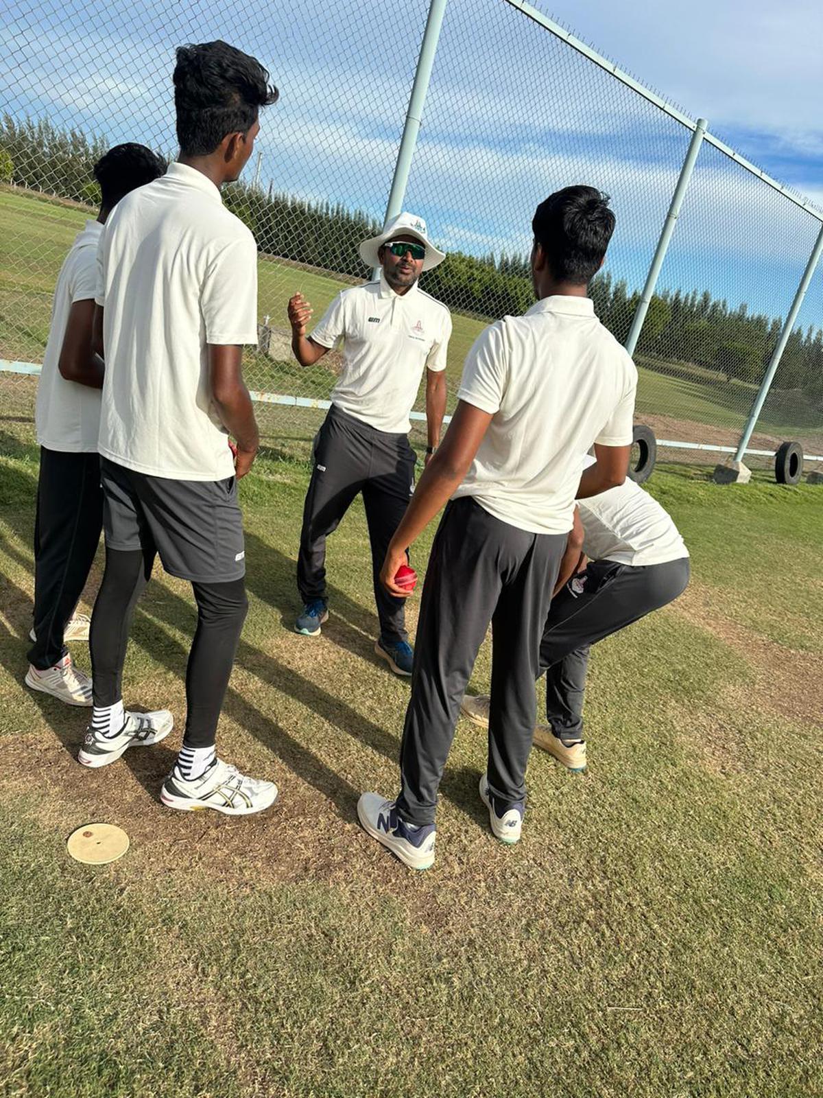 R. Jesuraj with the pace bowlers in Tiruppur.