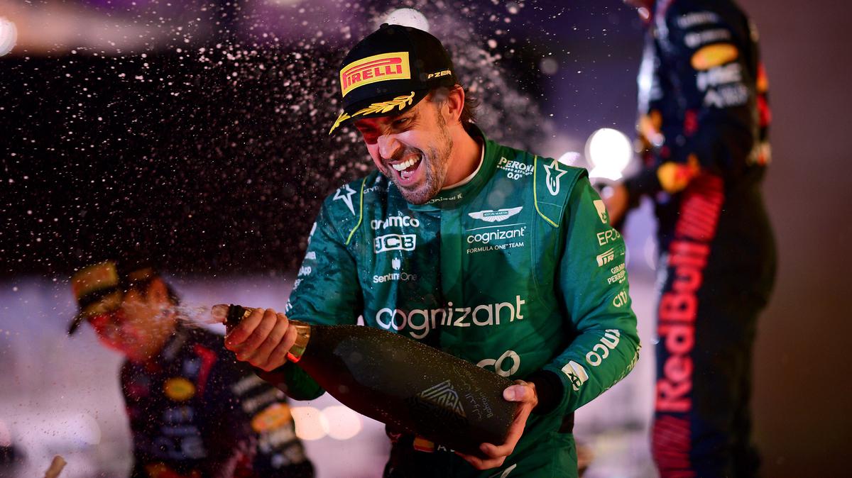 Champagne moment: Fernando Alonso capitalised on Aston Martin’s stunning improvement to make it onto the podium. 