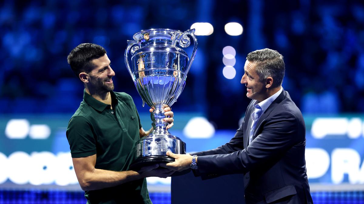 Novak Djokovic gets his trophy after securing year-end No. 1 ranking for a record-extending 8th time