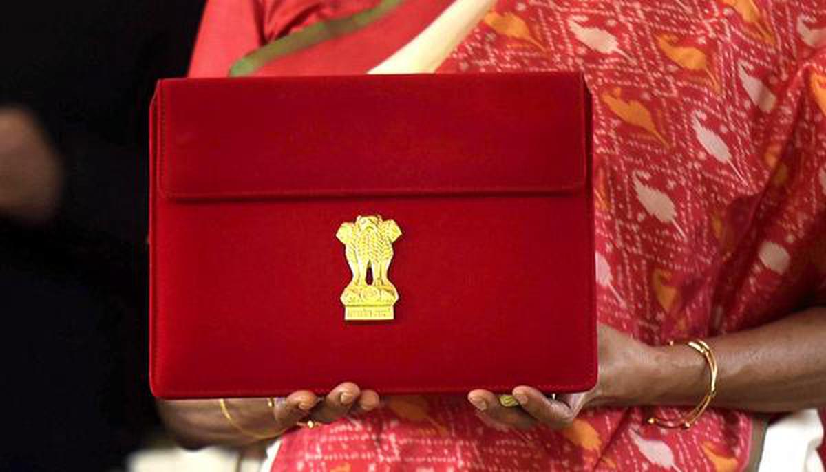 New Delhi: Finance Minister Nirmala Sitharaman holds a case containing a tablet device, during the Budget Session of the Parliament, at Parliament House in New Delhi, Monday, Feb. 1, 2021. Sitharaman replaced the ‘bahi khata’ and switched to a tablet, with the Union Budget set to be delivered in paperless form for the first time. 