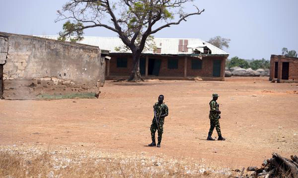 Nigerian soldiers patrol the Kuriga school where students were kidnapped, in Kaduna in March 2024.