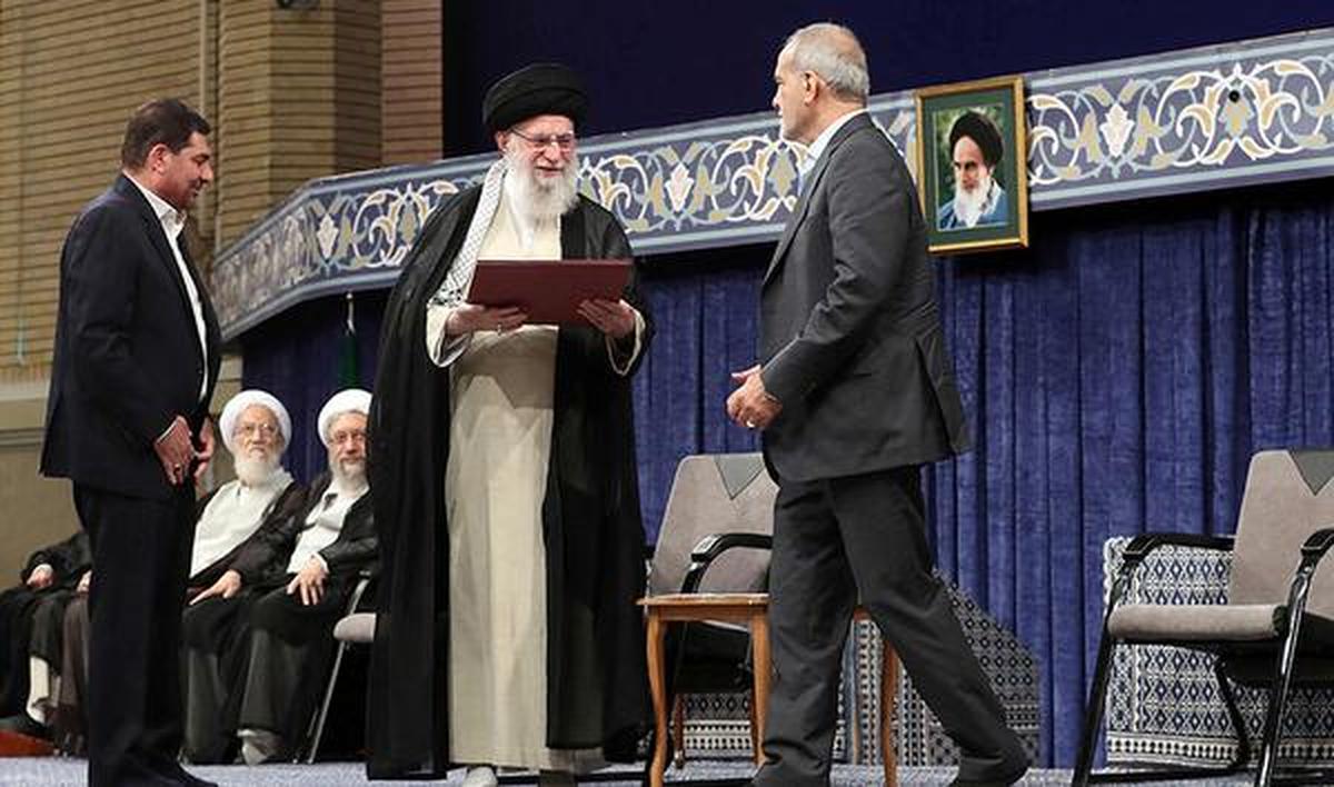 Ayatollah Ali Khamenei delivers the endorsement letter to President-elect Masoud Pezeshikan. 