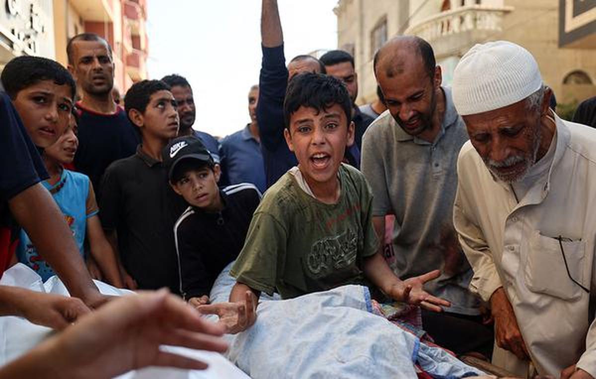 Sudden shock: The brother of a child killed in Israeli strikes that hit a water collection point in Nuseirat in the Gaza Strip on Sunday. AFP EYAD BABA Sudden shock: The brother of a child killed in Israeli strikes that hit a water collection point in Nuseirat in the Gaza Strip on Sunday. AFP EYAD BABA