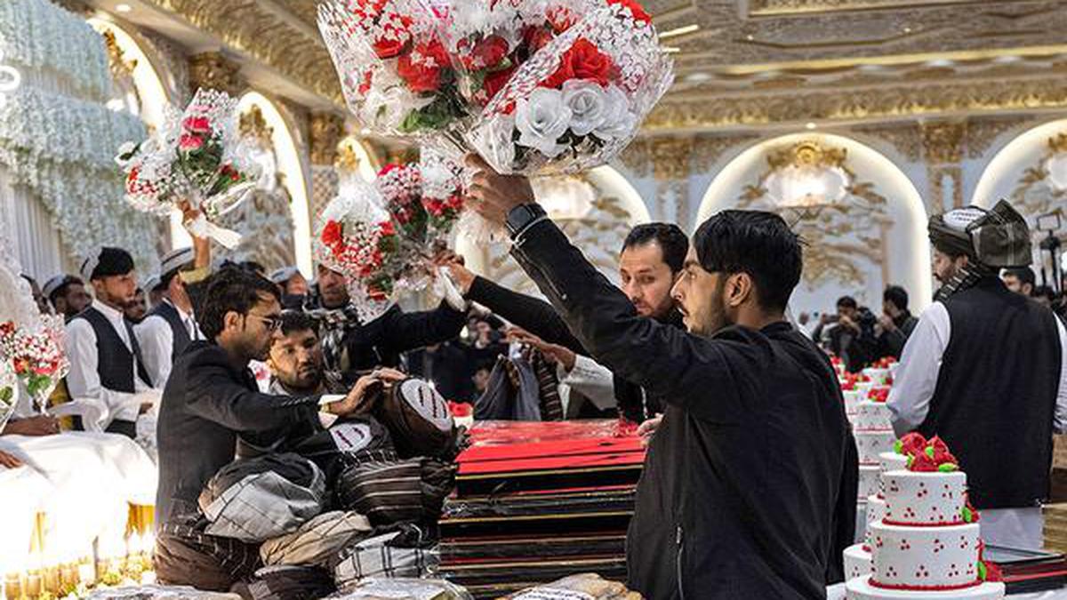 Afghans marry in mass ceremony in a bid to cut costs