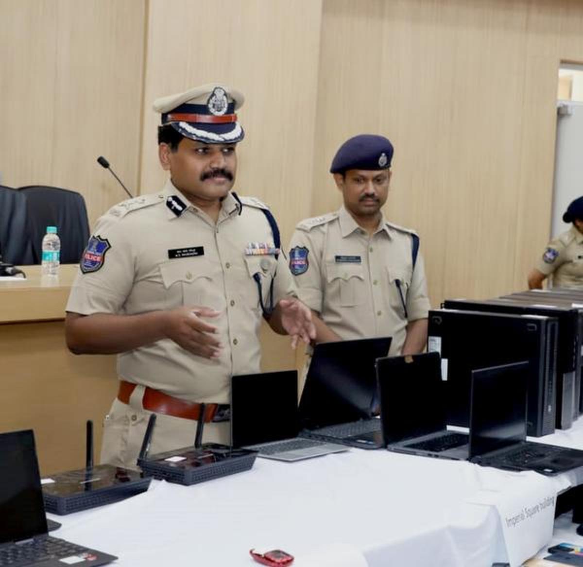 Cyberabad Police Commissioner Stephen Raveendra explaining about the scam in which CPUs, laptops, monitors, routers, mobile phones and other equipment (in picture) were used. The telecallers were from Gujarat, Assam, Delhi, Jharkhand, Mizoram, Manipur, Nagaland, Maharashtra, Uttar Pradesh, and West Bengal.
