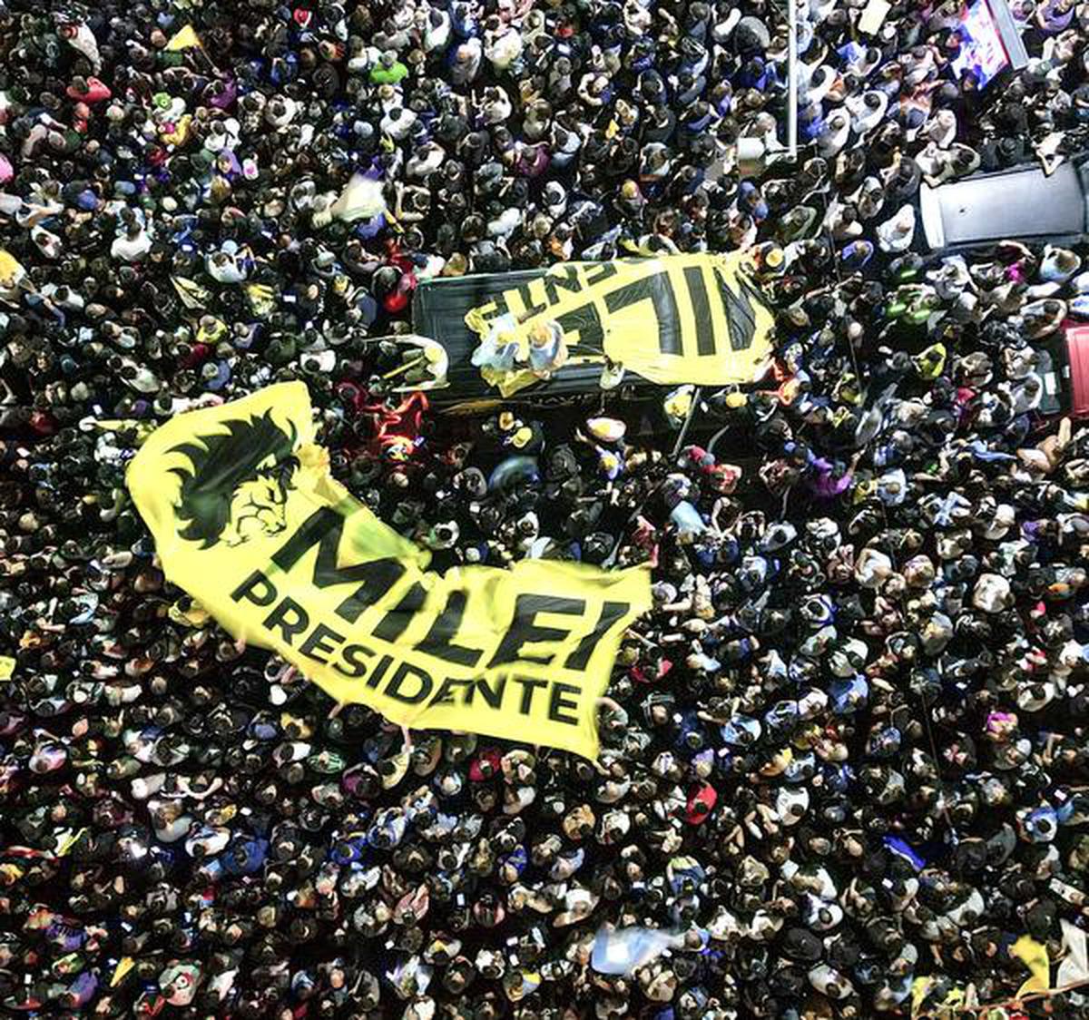 Supporters of Javier Milei gather outside his campaign headquarters after the election results on November 19. 