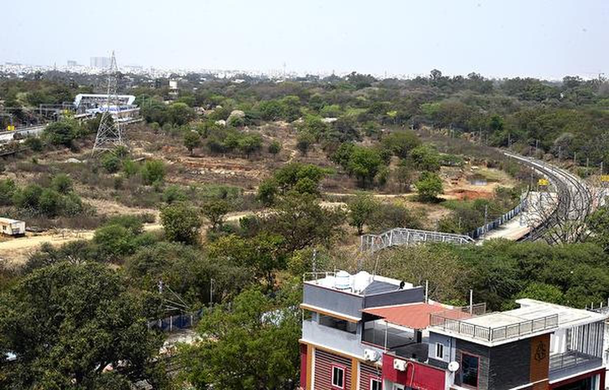 A view of the twin rail corridors near Ammuguda, showing the new Ammuguda station on the Ghatkesar–Sanathnagar line alongside the existing Ammuguda station on the Malkajgiri–Bolarum section. A view of the twin rail corridors near Ammuguda, showing the new Ammuguda station on the Ghatkesar–Sanathnagar line alongside the existing Ammuguda station on the Malkajgiri–Bolarum section.