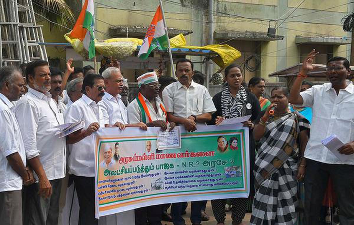 Congress workers stage protest in front of school