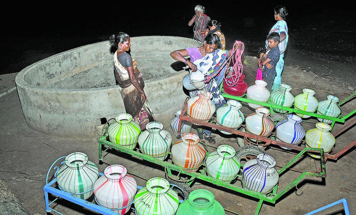 Waiting game: Women draw water at night from the almost dry well in Maravaikudi in Kadaladi block of Ramanathapuram district.