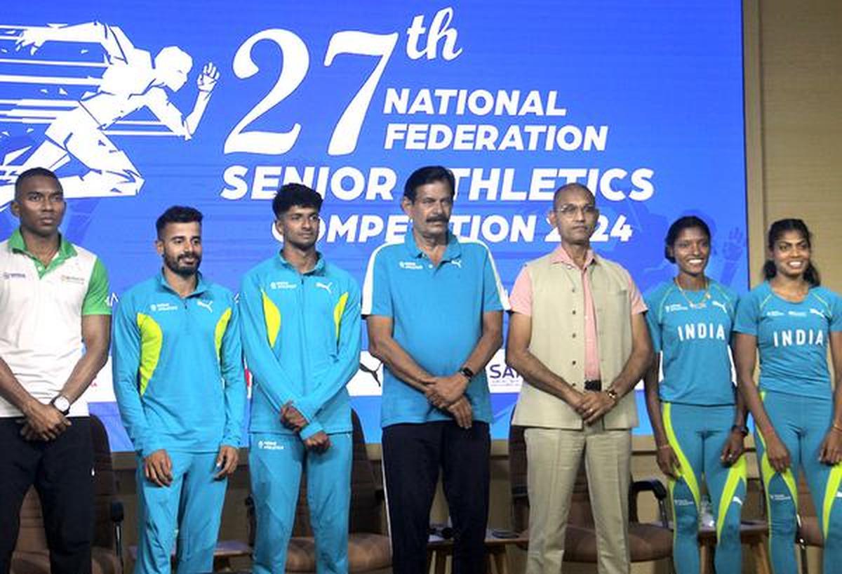 India chief coach Radhakrishnan Nair, centre. India chief coach Radhakrishnan Nair, centre.