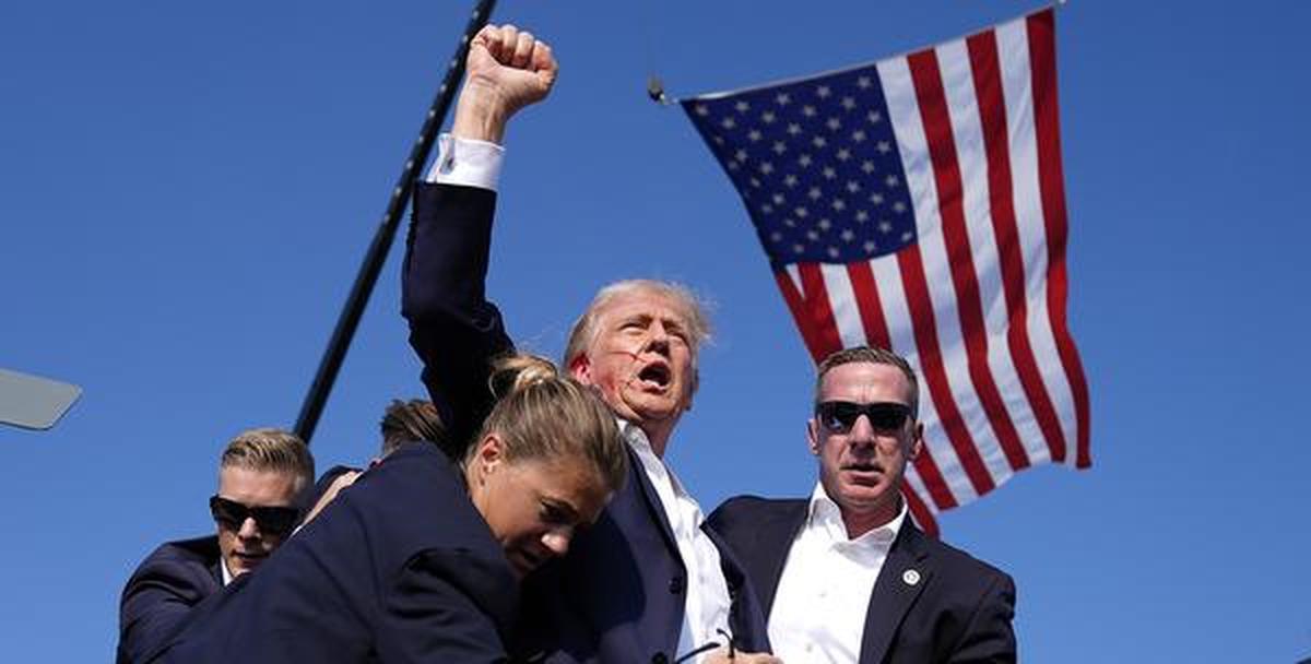 Clean shaven: Republican presidential candidate and former US President Donald Trump is surrounded by US Secret Service agents following the shooting at a campaign rally in Pennsylvania on Saturday. 