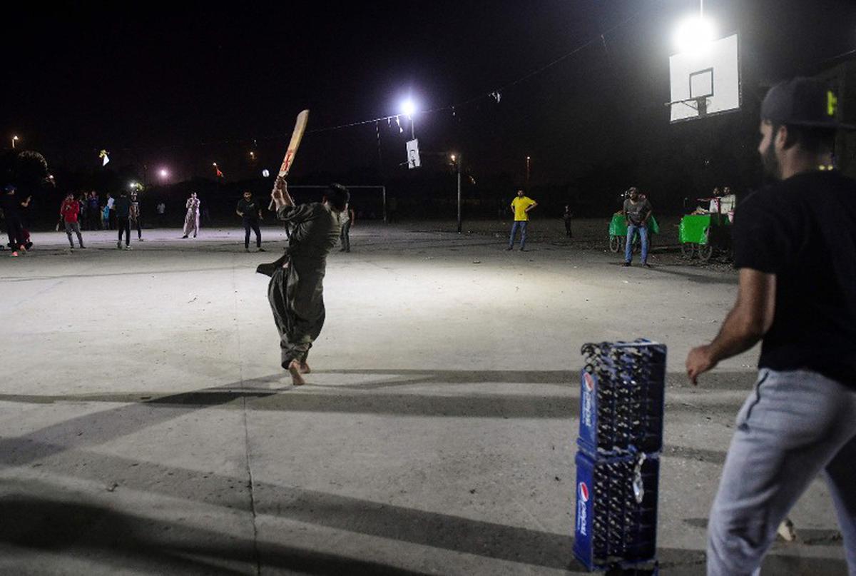 During Ramzan, street cricket lights up Karachi after midnight